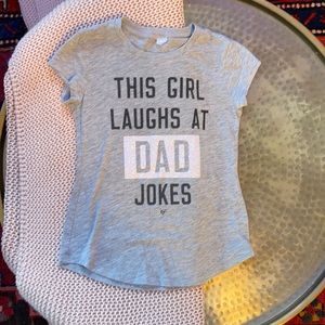 This Girl Laughs at Dad Jokes Glitter Tee